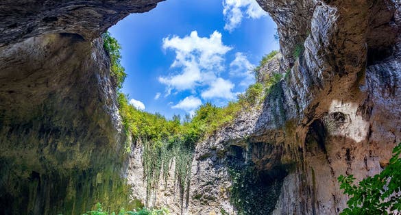 Photo of view inside the Devetashka Cave near Devetaki village and Osam river in Lovech, Bulgaria. Natural wonder. One of the largest karst cave in Eastern Europe.