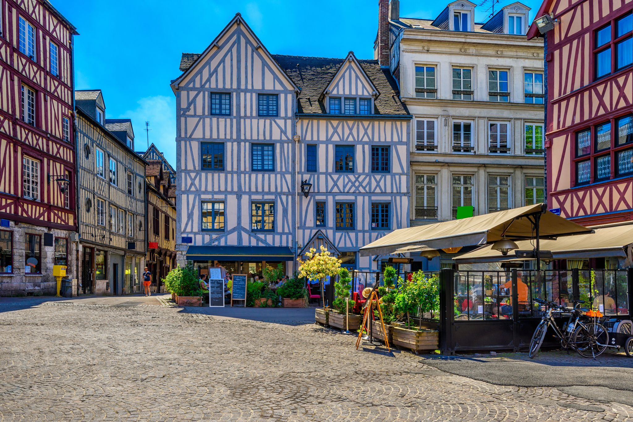 Photo of cozy street with timber framing houses in Rouen, Normandy, France.