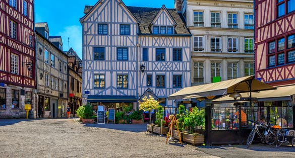 Photo of cozy street with timber framing houses in Rouen, Normandy, France.
