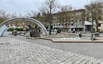 Photo of scenic summer view of the German traditional medieval half-timbered Old Town architecture and bridge over Pegnitz river in Nuremberg, Germany.