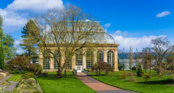 Glasshouse at the Royal Botanical Gardens in public park Edinburgh, Scotland, UK.