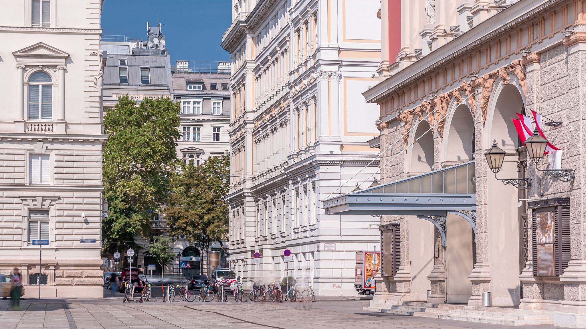 photo of view of The Wiener Musikverein timelapse (Viennese Music Association) is a famous Vienna concert hall. It was built in 1870. Street with green trees on a background,Vienna Austria.