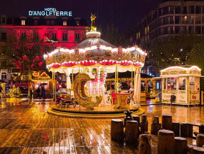 Vintage carousel lit up at night during the Geneva Christmas Market in Switzerland..jpg