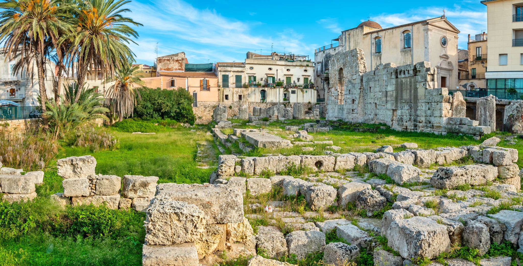 Panoramic view to ancient Doric Temple of Apollo in Ortigia island. Syracuse, Sicily, Italy.