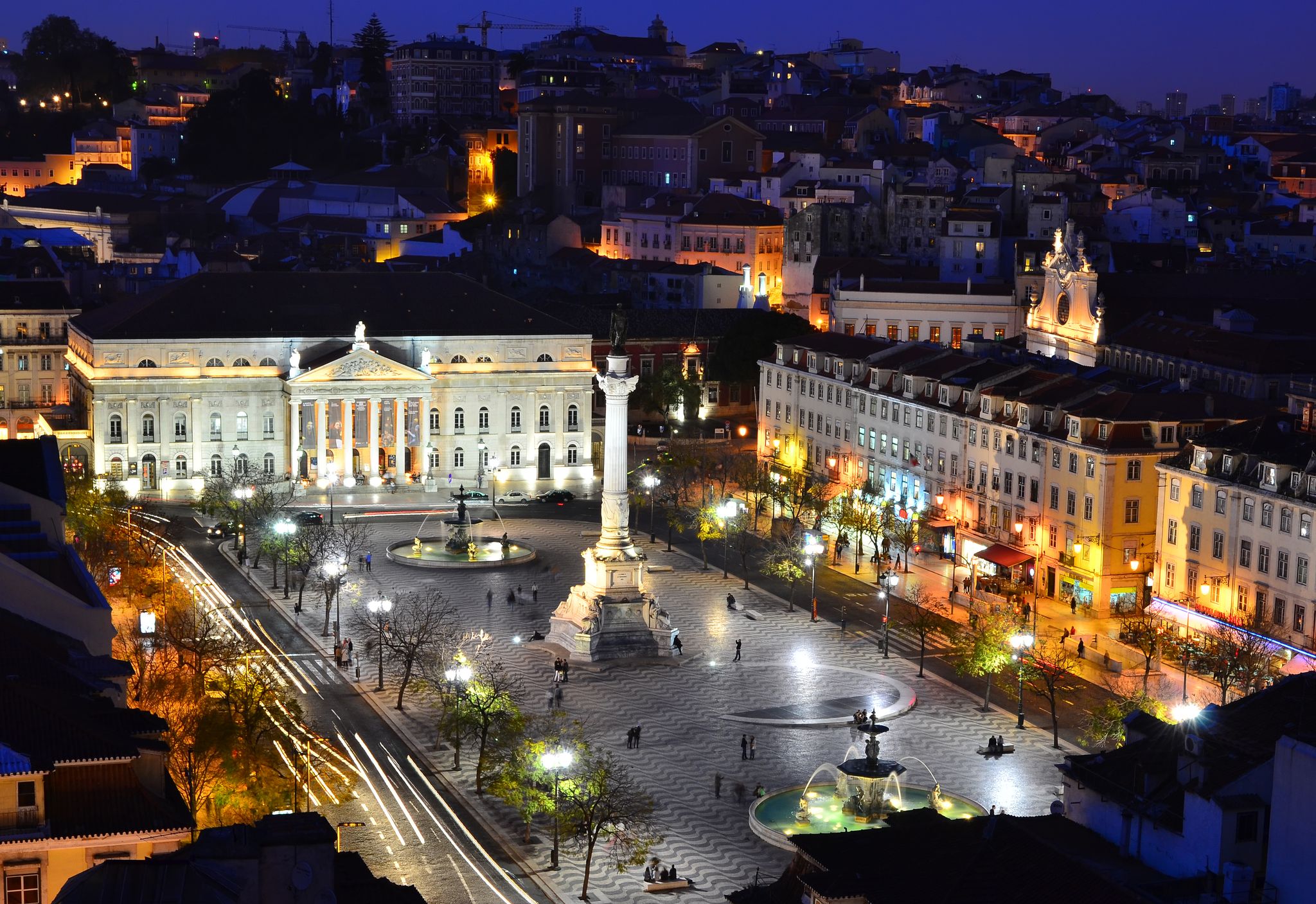 Photo of View of Rossio Square at night and Maria II Theatre, seen from Santa Just elevador. Lisbon, Portugal.