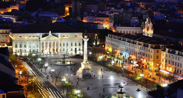 Photo of View of Rossio Square at night and Maria II Theatre, seen from Santa Just elevador. Lisbon, Portugal.