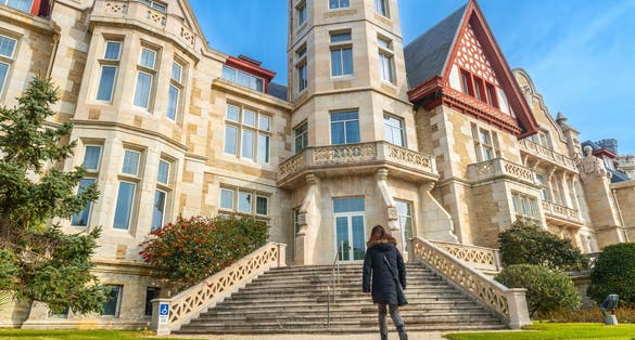 photo of view  of A woman walking in the Magdalena Palace in the city of Santander, Spain