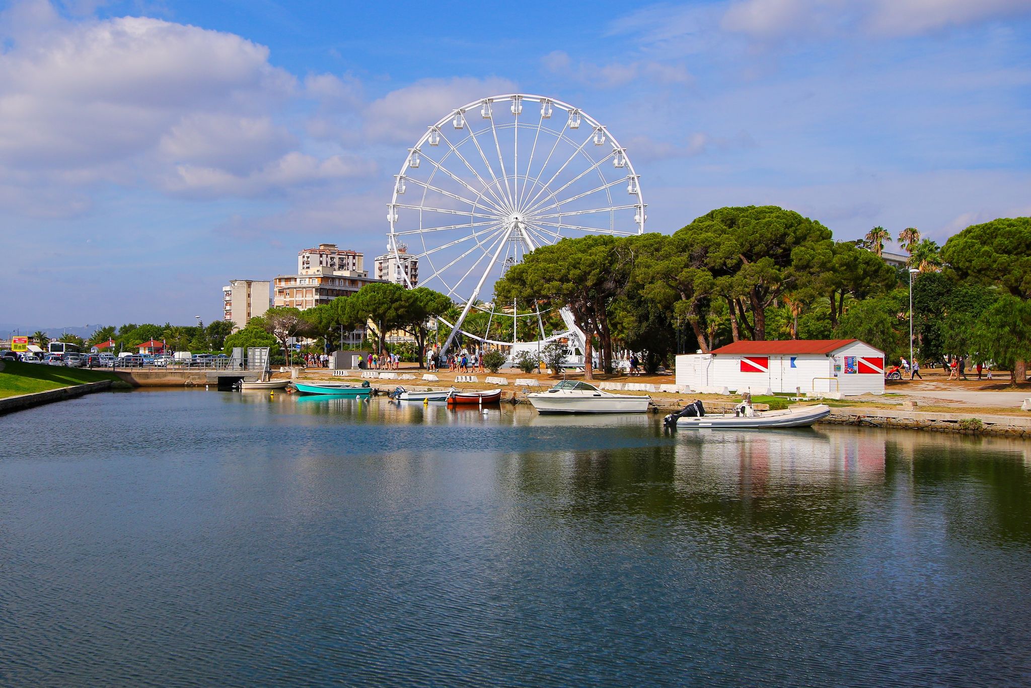 photo of Ferris wheel in a park of Olbia in Sardinia, Italy, by the Tyrrhenian Sea.