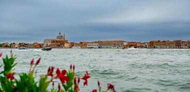 Famous buildings, gondolas and monuments by the Rialto Bridge of Venice on the Grand Canal, Italy.