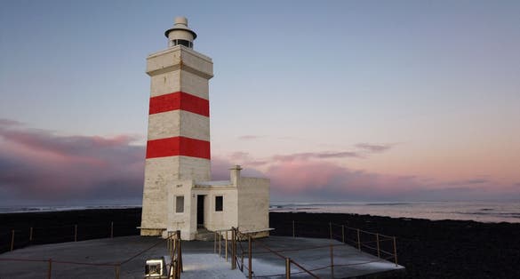 photo of view The old lighthouse in Gardur at Reykjanes Peninsula Iceland in winter, Southern Peninsula, Iceland.