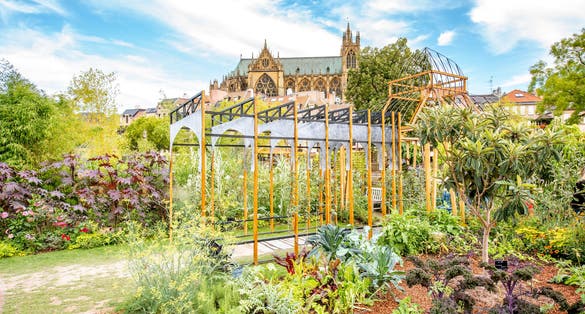 Photo of beautiful garden on Comedy square with cathedral on the background in Metz city, France.