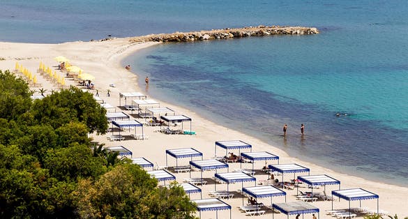 Photo of Kallithea sunny beach and summer resort at Kassandra of Halkidiki peninsula in Greece.