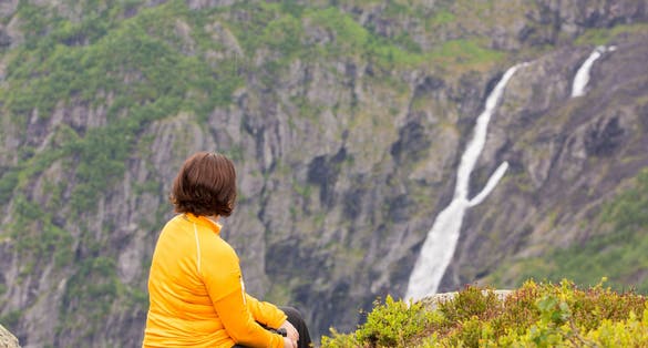 Relaxation and meditation in the mountains overlooking the wonderful waterfall.