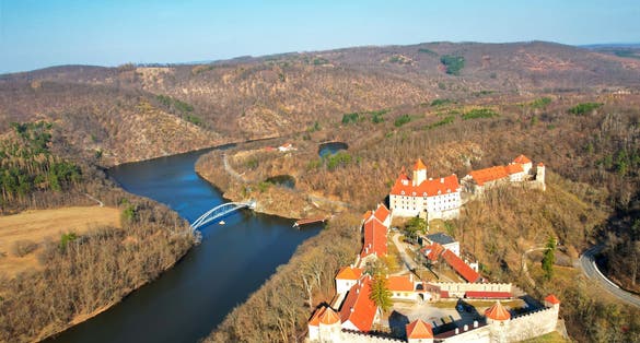 Photo of aerial view of the castle "Veveri" and the Brno dam, beautiful evening light, Czechia.