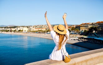 Famous buildings, gondolas and monuments by the Rialto Bridge of Venice on the Grand Canal, Italy.