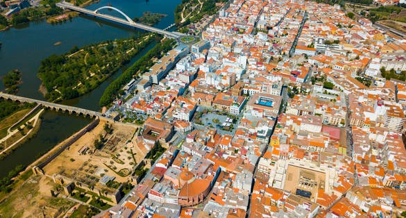 photo of view of Scenic aerial view of Spanish city of Merida with ancient Roman Bridge and modern Lusitania Bridge over Guadiana river