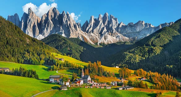 photo of view of Famous alpine place Santa Maddalena village with magical Dolomites mountains in background, Val di Funes valley, Trentino Alto Adige region, Italy.