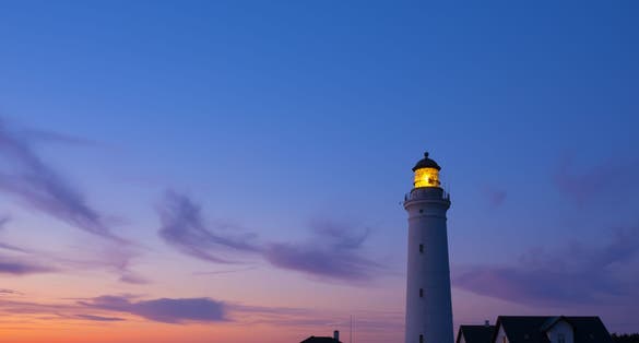 Photo of scenic view of lighthouse of Hirtshals at beautiful sunset in Denmark.