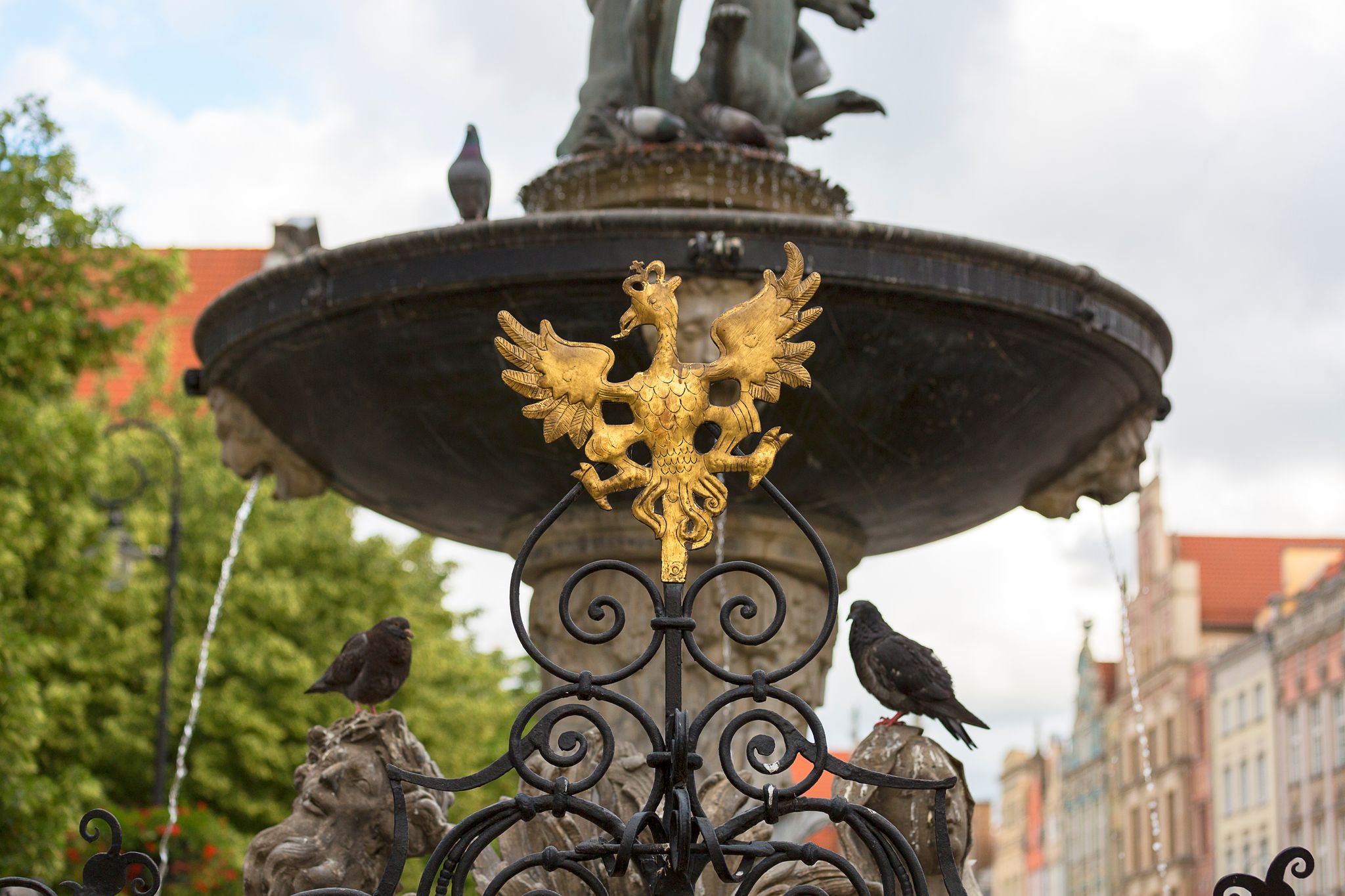 Photo of Neptune's Fountain Statue at Long Market Street, figures on a pedestal, Gdansk, Poland.