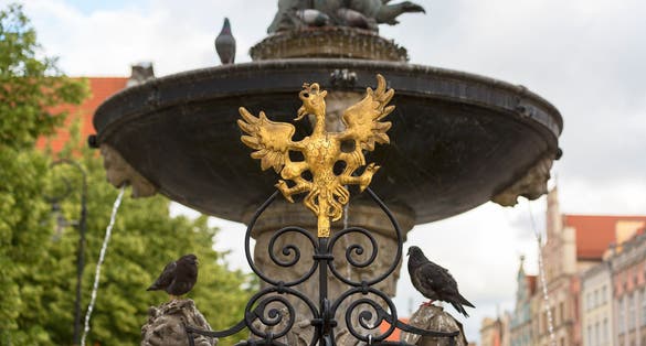 Photo of Neptune's Fountain Statue at Long Market Street, figures on a pedestal, Gdansk, Poland.