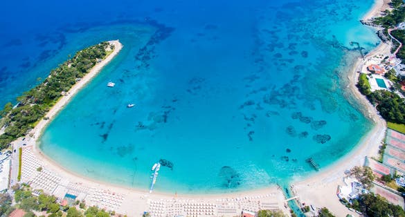Photo of beautiful turquoise colors of Mediterranean sea. Drone shot of beach in Kemer ,Antalya ,Turkey.
