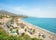 Photo of aerial view of beach in Nerja, Malaga province, Costa del Sol, Andalusia, Spain.