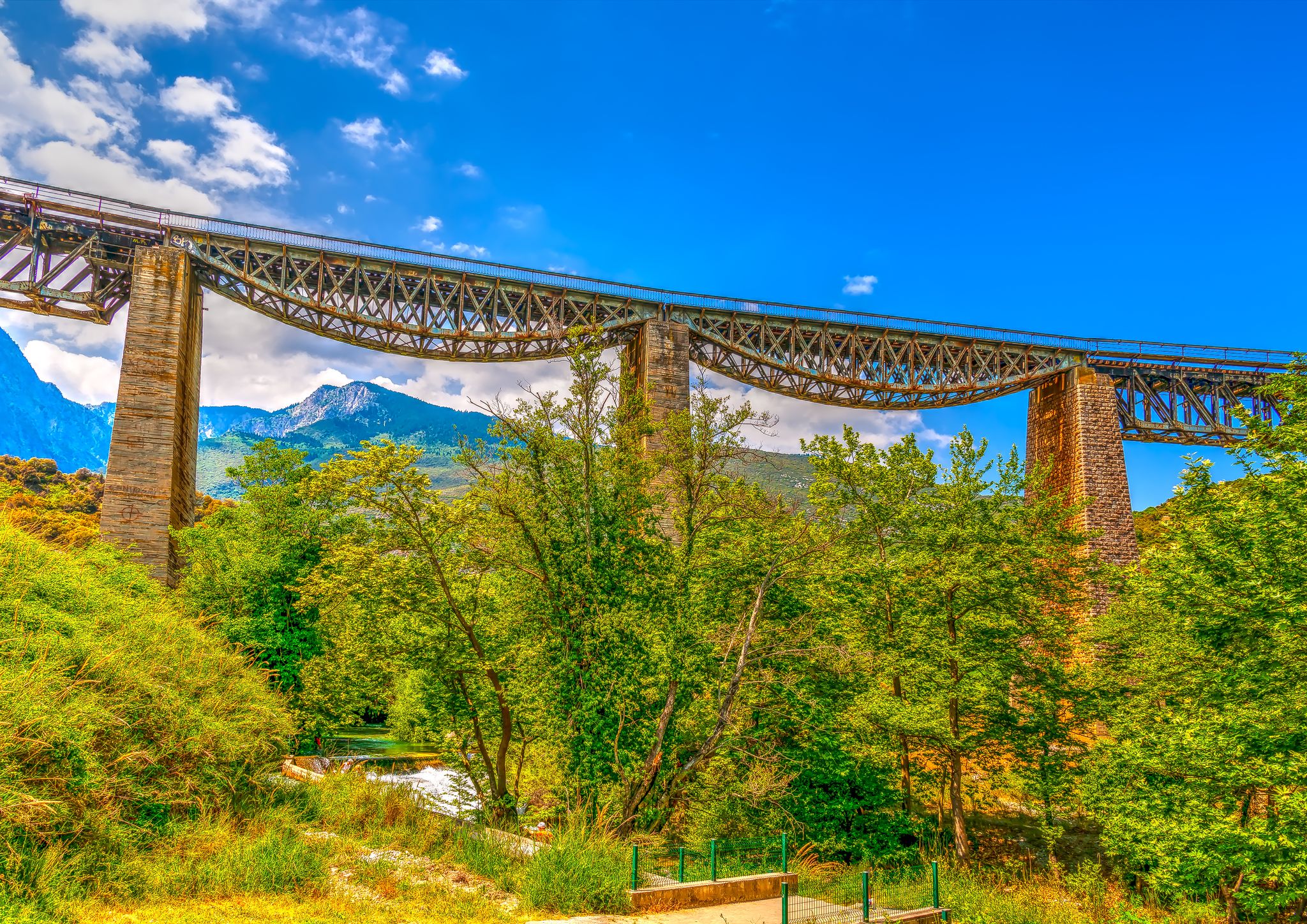 photo of view of The historic bridge of Gorgopotamos river in central Greece.,Skiathos Greece.
