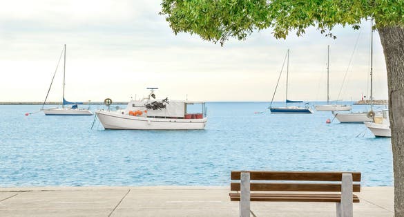 Umag croatia.beautiful promenade by the sea with a view of fishing boats.Mediterranean tourist destination.