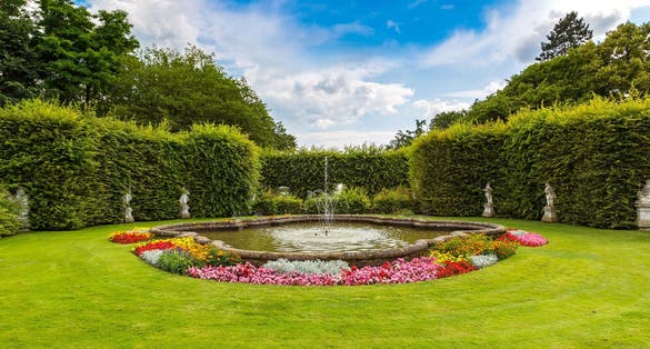 PHOTO OF Fountain in a park in Trier in a beautiful summer day, Germany.