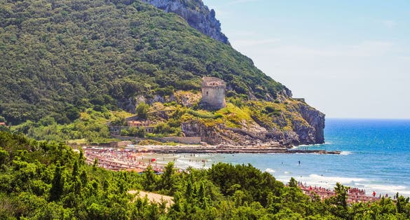 Ancient defense tower Torre Paola on a hill near the Mediterranean Sea in the Circeo National Park. Coast of Lungomare di Sabaudia, province of Latina, Lazio region in central Italy.
