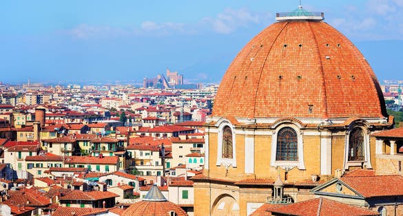 photo of Cityscape with Medici Chapel and the old town of Florence, Italy .