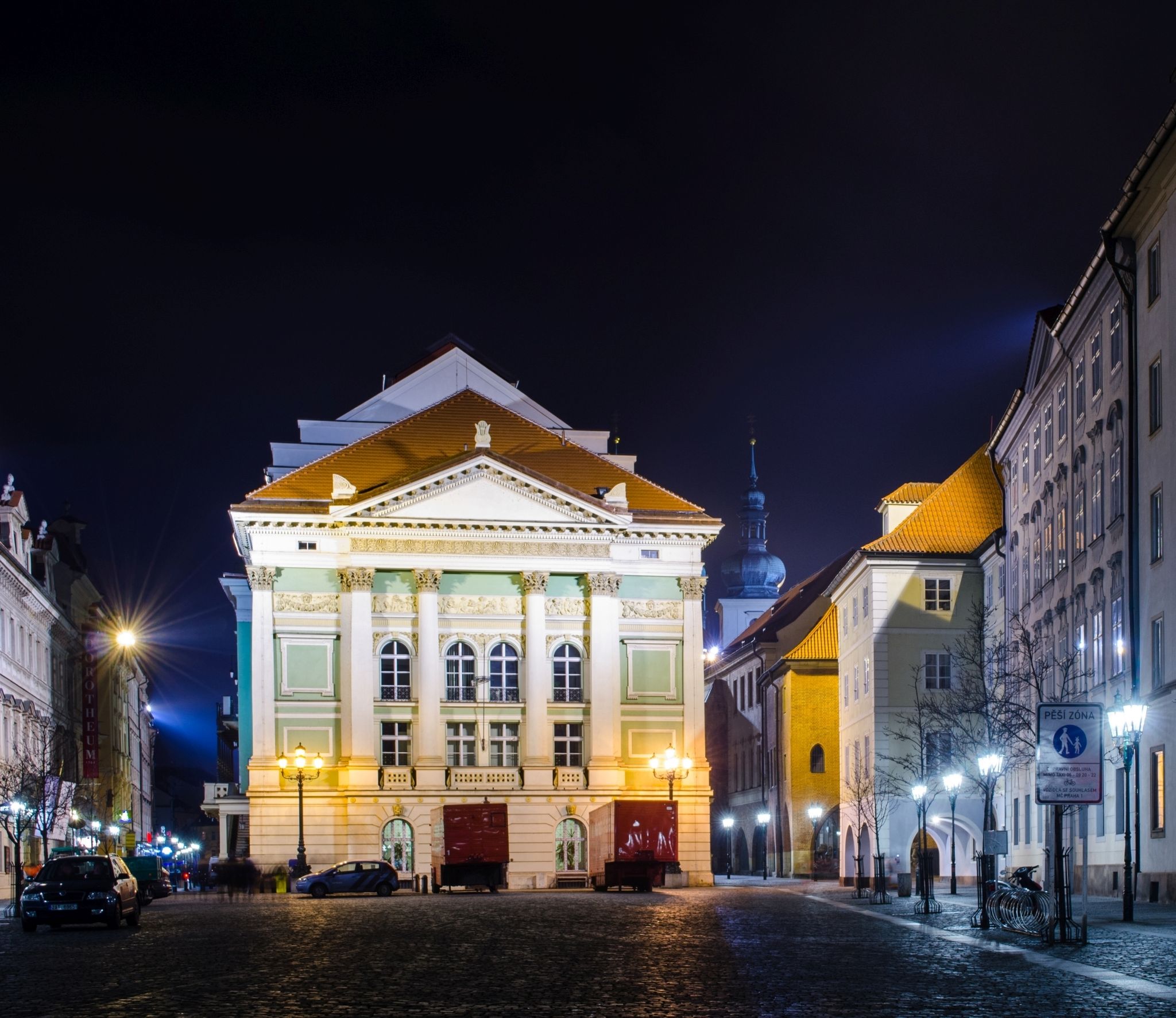 Photo of night view of the illuminated stavovske divadlo theatre where mozarts piece don giovanni had international premiere. Prague old town, Czechia.