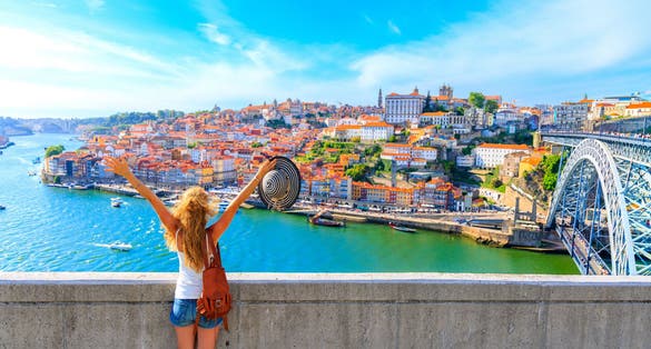 Photo of cityscape panoramic view of Happy traveler woman in Porto, Portugal.