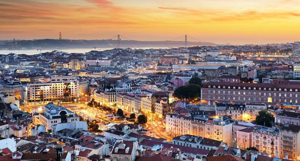Photo of scenic view of Lisbon at sunset, Portugal.