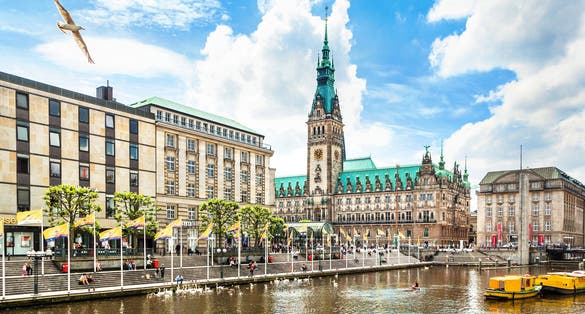 Photo of beautiful view of Hamburg city center with town hall and Alster river, Germany.