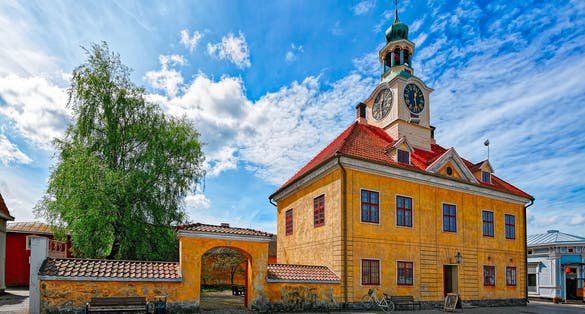 Photo of Old Rauma town hall, the only stone building among hundreds of wooden houses, Finland.