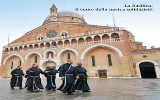 Photo of beautiful view of canal with statues on square Prato della Valle and Basilica Santa Giustina in Padova (Padua), Veneto, Italy.