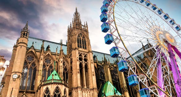 Photo of Cathedral Saint-Etienne with Christmas market and big wheel, city of Metz, France.