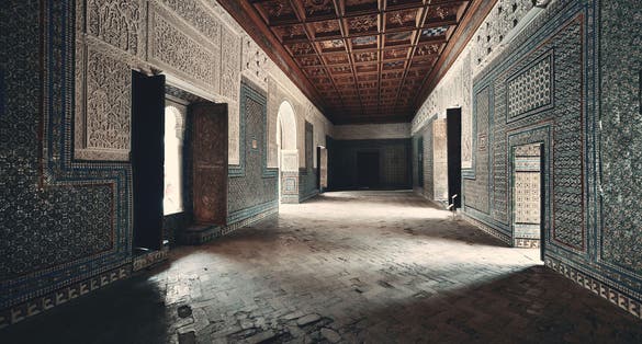 Photo of Casa de Pilatos interior view with beautiful patterns and decoration in Seville, Spain.