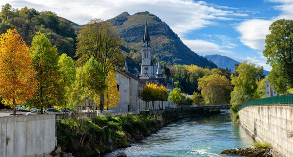 Photo of view of the basilica of Lourdes in autumn, France.