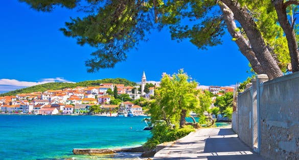 Photo of Zadar archipelago. Kali on Ugljan island turquoise sea and walkway view, Croatia.