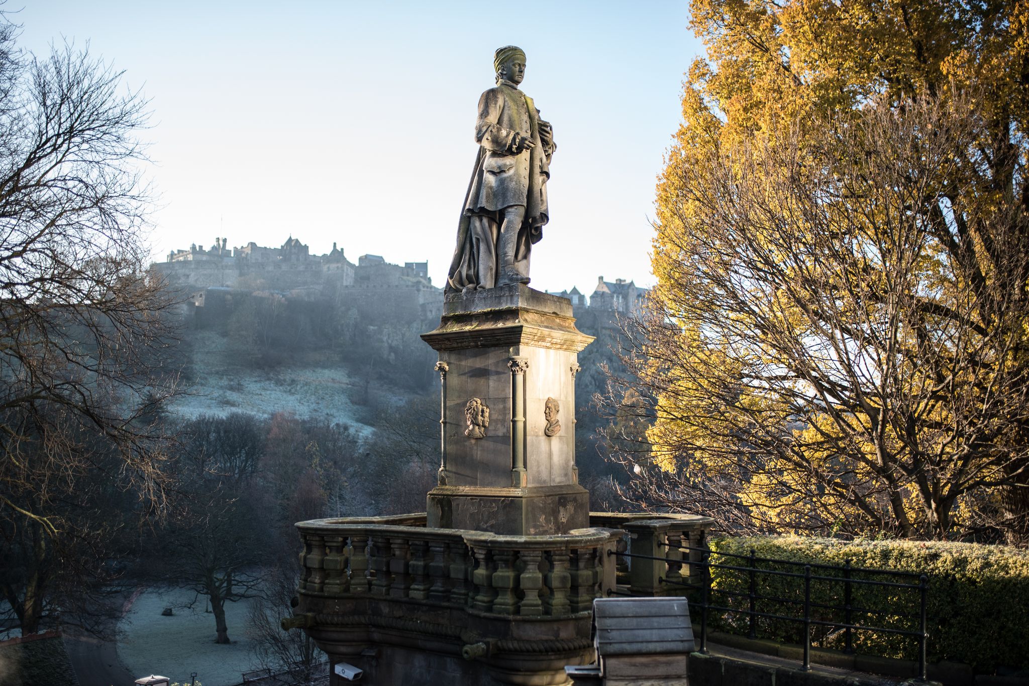 Princes Street Allan Ramsay statue in autumn next to yellow leaf tree, Edinburgh.jpg