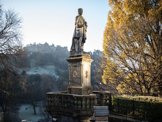 Princes Street Allan Ramsay statue in autumn next to yellow leaf tree, Edinburgh.jpg