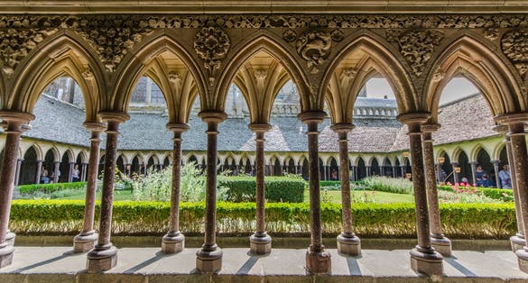 Photo of columns in cloister of the church on the top of hill of le Mont Saint Michel, It is one of France's most famous landmarks.