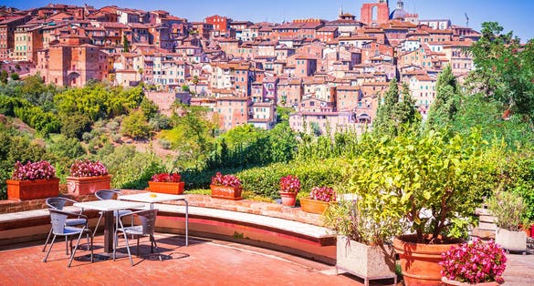 photo of view of Siena, Italy. Charming medieval city in Tuscany known for its stunning cathedral, Torre del Mangia, beautiful piazzas, and the famous Palio horse race.