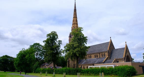Photo of exterior of Holy Trinity Church in Platt Fields, Manchester, UK.