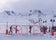 photo of panoramic view of Erciyes Ski Resort with people skiing on the ski slope in Kayseri, Turkey.