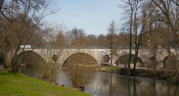 photo of view of Sternbrueke bridge over Ilm river in Park an der Ilm, Weimar, Thuringia, Germany.