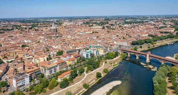 Aerial view of Pavia and the Ticino River, View of the Cathedral of Pavia, Covered Bridge. Lombardia, Italy