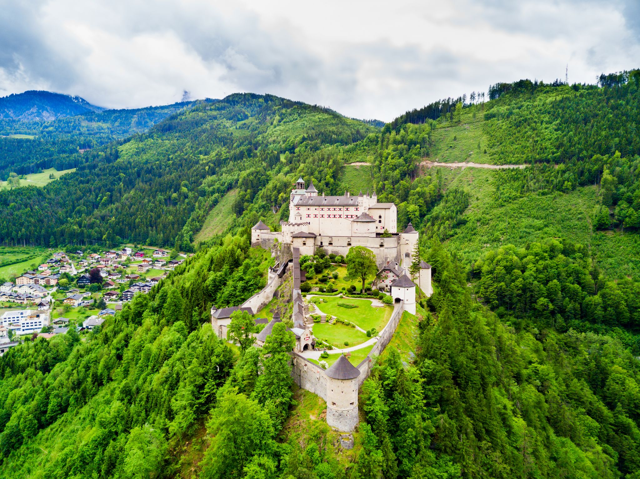 Hohenwerfen Castle or Festung Hohenwerfen aerial panoramic view. Hohenwerfen is a medieval rock castle overlooking the Austrian Werfen town in Salzach valley, Austria